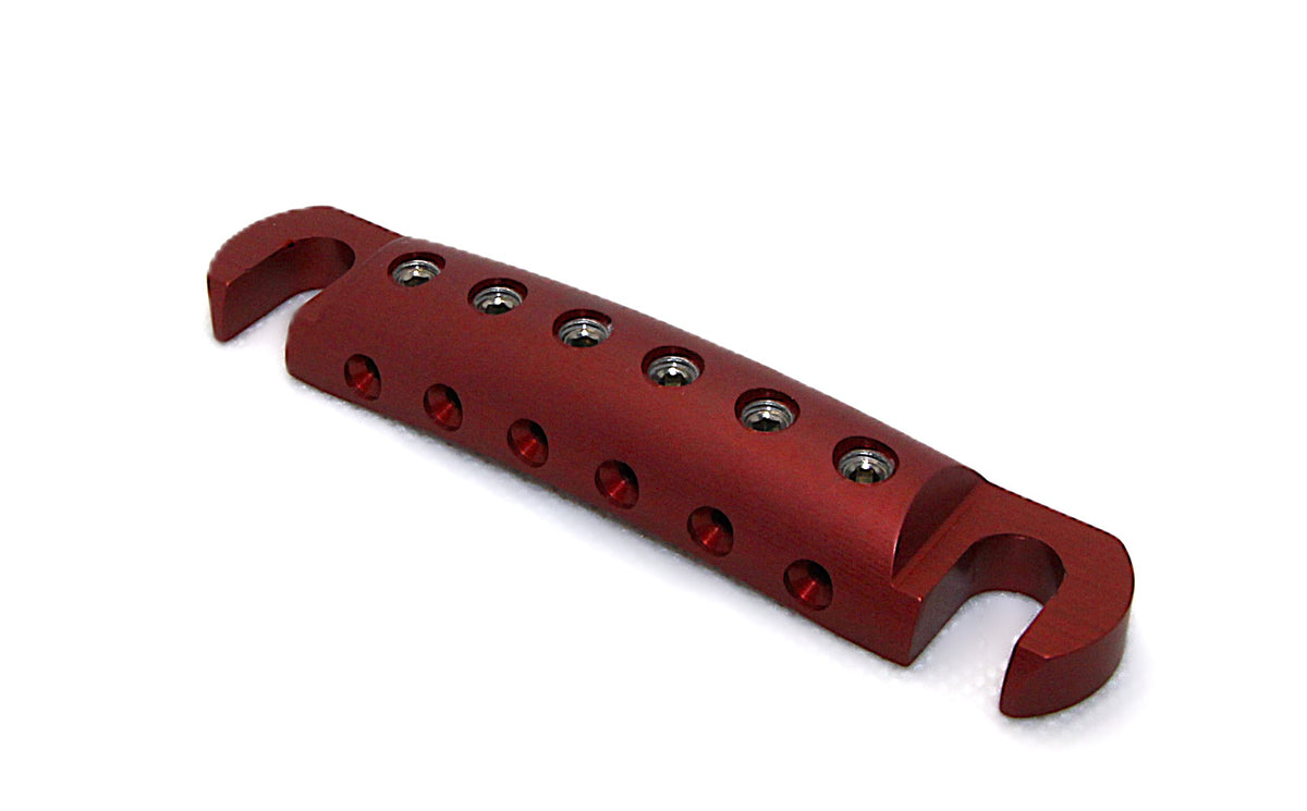 Dark rose anodized Steadfast Stopbar at an angle, showing the six string-locking set screws. Best Quality