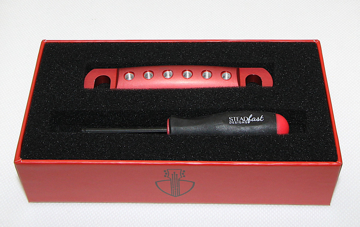 Dark rose anodized Steadfast Stopbar in its presentation box with the Steadfast hex driver. Best Quality