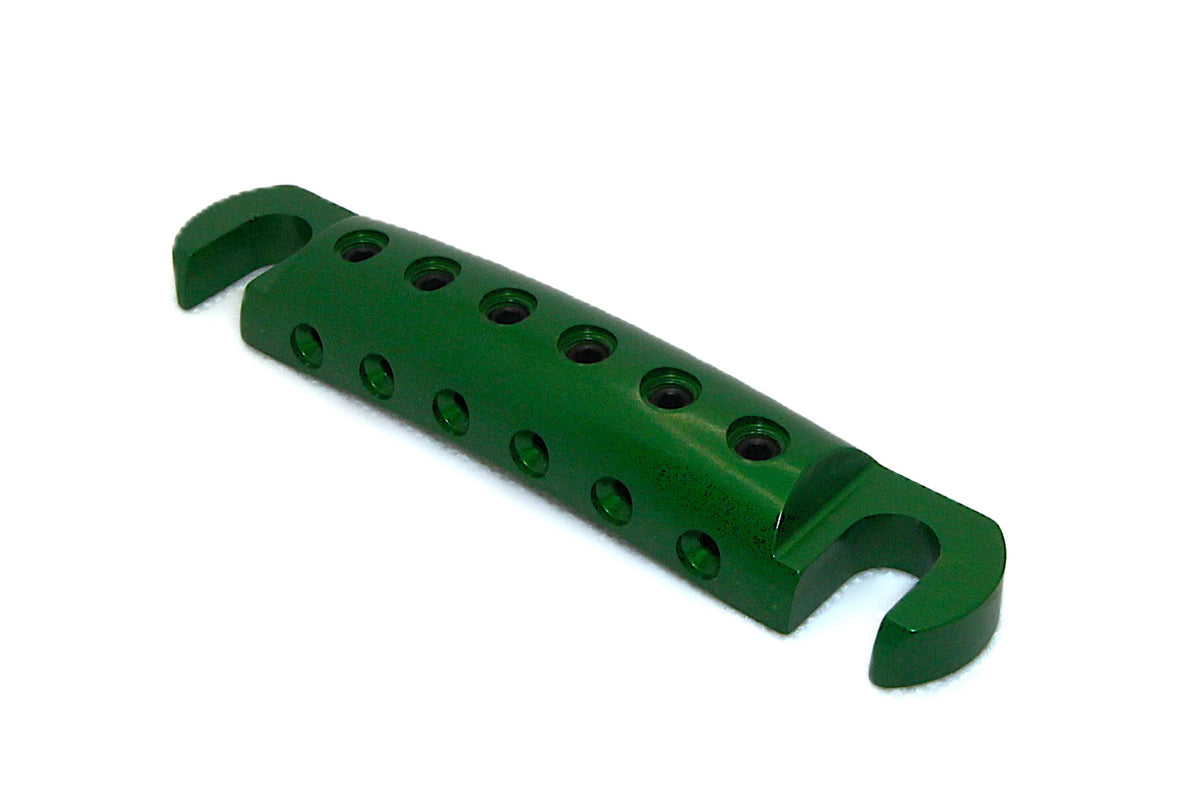 Bright green anodized Steadfast Stopbar at an angle, showing the string holes and stud slots. Best Quality