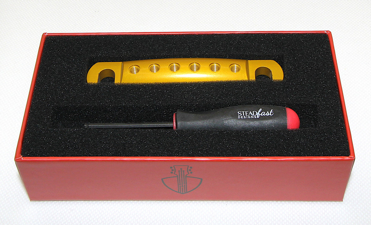 Polished gold anodized Steadfast Stopbar in its presentation box with the Steadfast hex driver. Best Quality