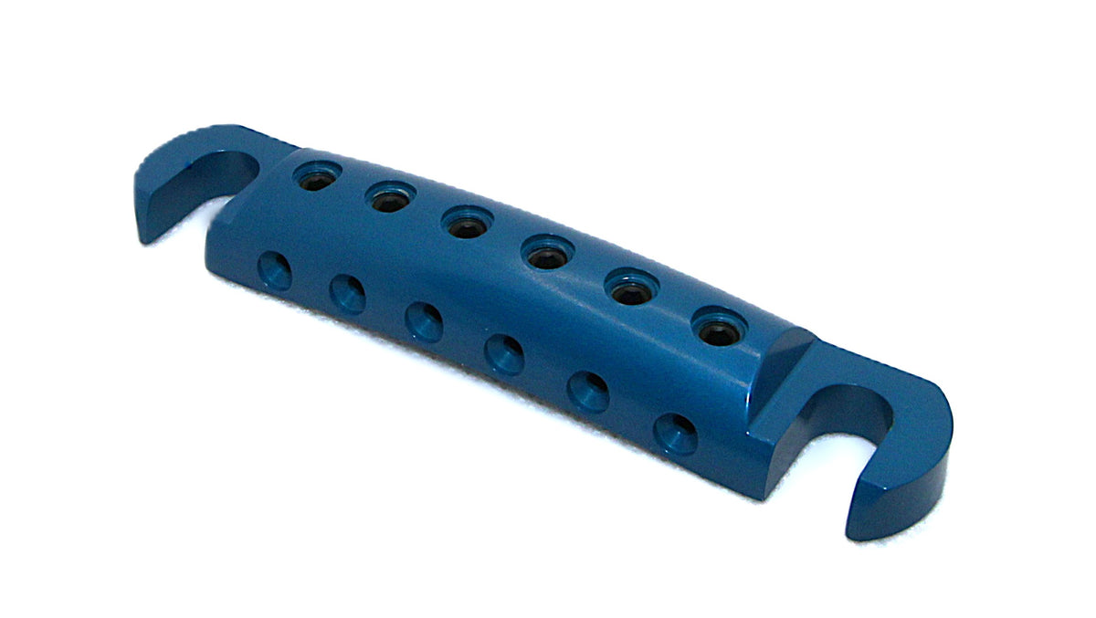 Teal blue anodized Steadfast Stopbar at an angle, showing the string holes and stud slots. Best Quality
